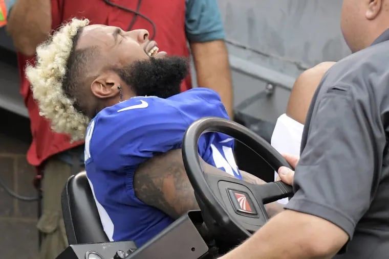 Giants wide receiver Odell Beckham reacts while being carted off the field after an injury during the second half against the Chargers in Week 5. (AP Photo/Bill Kostroun)