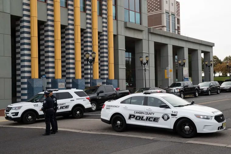 Police block the street outside New Jersey Democratic Sen. Cory Booker's office in Camden Friday. The FBI said a suspicious package addressed to Booker was recovered in Florida.