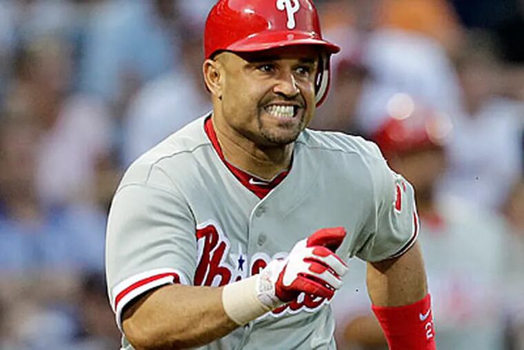 Placido Polanco was at the plate when the Phillies' eventual winning run scored off a wild pitch. (David Goldman/AP)