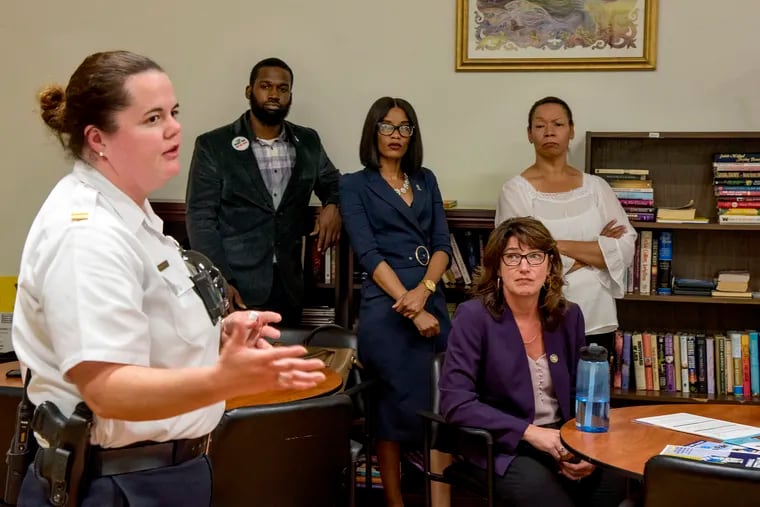 Commanding officer of the 26th District, Philadelphia Police Capt. Krista Dahl-Campbell, speaks during a training session in Fishtown hosted by State Rep. Mary Isaacson (seated) for people who experience street harassment, as well as bystanders. It was conducted by Women Organized Against Rape staffers Levonne Cannady (from left), LaQuisha Anthony, and Teresa White-Walston.
