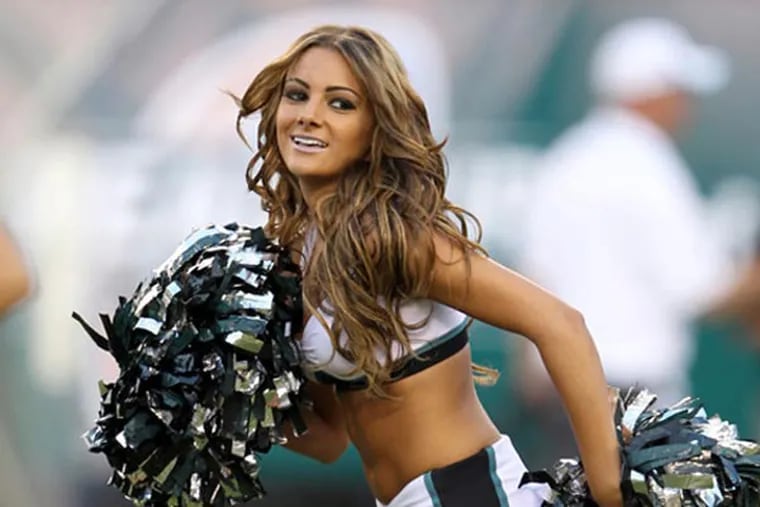 Eagles rookie cheerleader Michaelaann Guaracini performs while the Eagles play the Carolina Panthers in a preseason game on Thursday, August 15, 2013. (Yong Kim / Staff photographer)