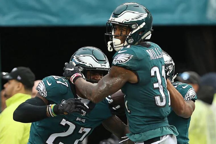 EaglesÕ Jalen Mills, center, celebrates with Malcolm Jenkins, left, after scoring a 2nd quater touchdown against the 49ers. Philadelphia Eagles play the San Francisco 49ers in Philadelphia, PA on October 29, 2017.