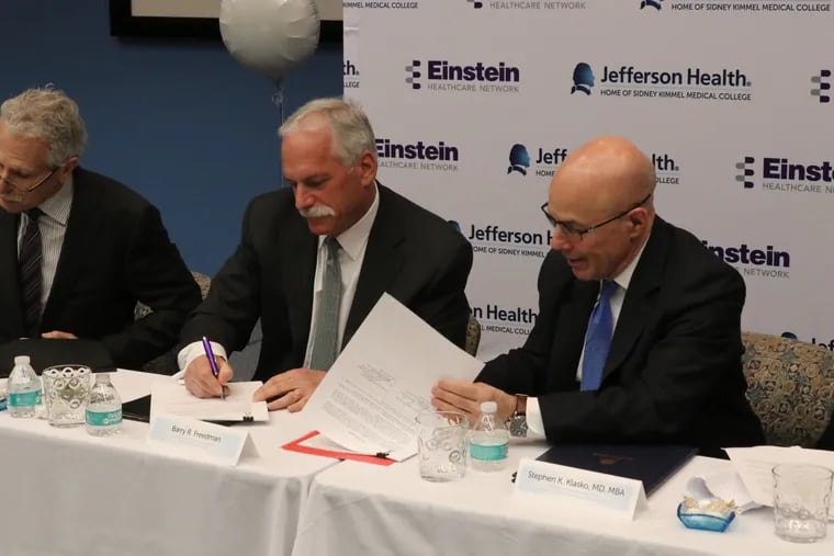 Einstein Healthcare Network  President and Chief Executive Officer Barry R. Freedman (left) and Stephen K. Klasko,   President and Chief Executive Officer of Thomas Jefferson University and Jefferson Health, sign the  non-binding Letter of Intent to merge the health care networks on March 28, 2018. A federal judge on Tuesday Dec. 8, 2020 rejected the FTC's suit to block the acquisition.  (Photo: Einstein Healthcare Network)