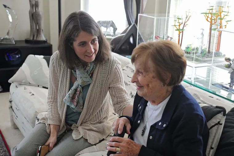 Danielle Snyderman, left, talks with Mildred Demchick, 92. Snyderman, a geriatrician, has been interviewing her elderly patients about their love stories to better understand them and their needs. ( CLEM MURRAY / Staff Photographer )