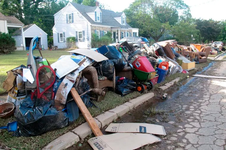 Ruined household possessions are piled at the curb in Manville, N.J., after remnants of Tropical Storm Ida caused massive flooding in the Raritan River town in September 2021.