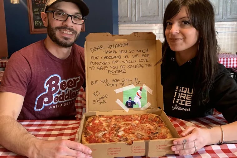 Square Pie owner Giuliano Lozzi, at left, with his cousin, Gianni Lozzi, at right, who came up with the idea for including a Philly message in the Atlanta Braves pizza order.
