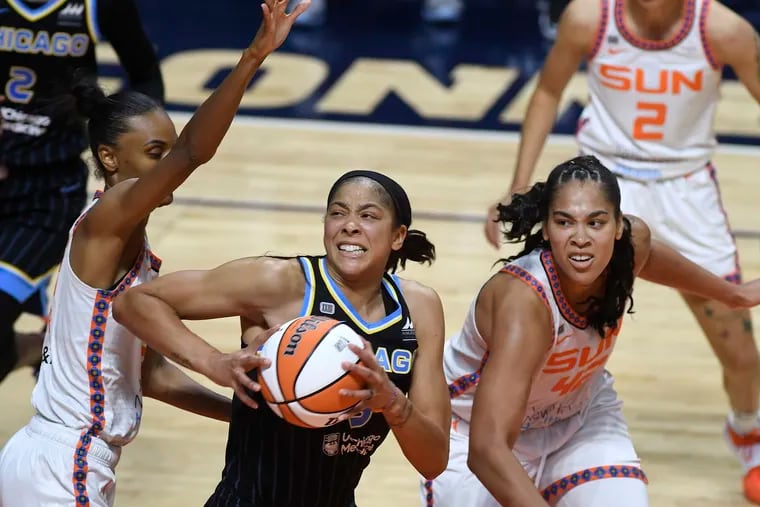 Chicago Sky forward Candace Parker (center) is paving the way for other women.