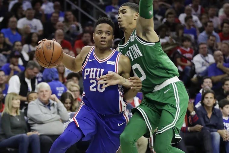 Sixers guard Markelle Fultz tries to drive past Celtics wing Jayson Tatum during their rookie seasons.