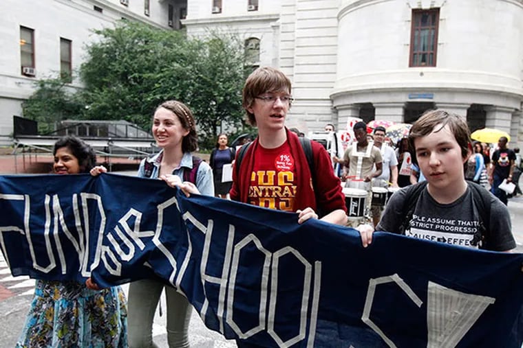 Science Leadership Academy students with a banner start marching from City Hall. ( AKIRA SUWA  /  Staff Photographer )