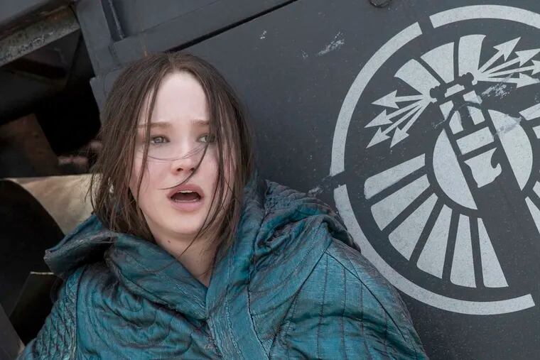 &quot;The Hunger Games: Mockingjay - Part 2,&quot; starring Jennifer Lawrence as Katniss Everdeen, sits atop the weekend box office for a third straight week.