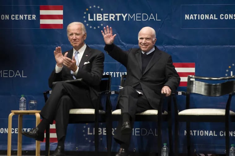 Sen. John McCain is on stage with former Vice President Joe Biden (left) before receiving the Liberty Medal at the National Constitution Center October 16, 2017.