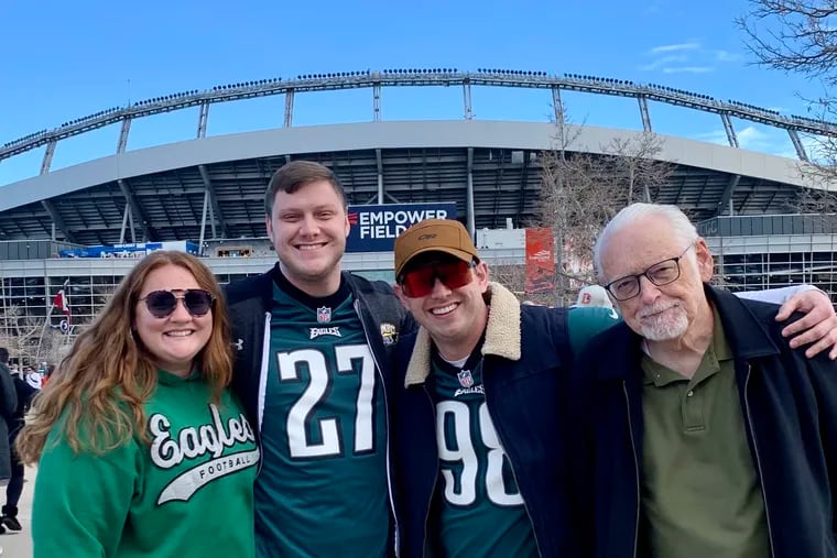 Retired Inquirer writer Les Bowen (right) with Brelyn Howard Bowen and sons Dan Bowen and Matt Bowen at Empower Field at Mile High.
