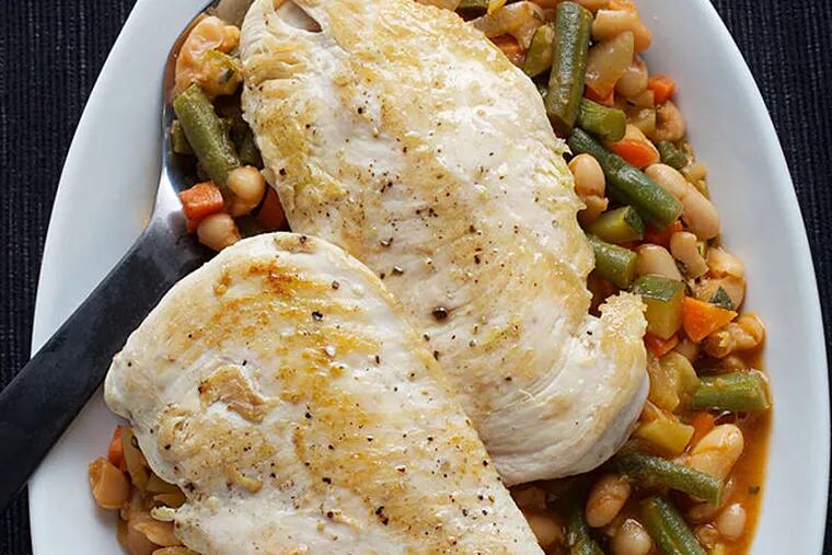Chicken with a vegetable ragout. (DEB LINDSEY / Washington Post)