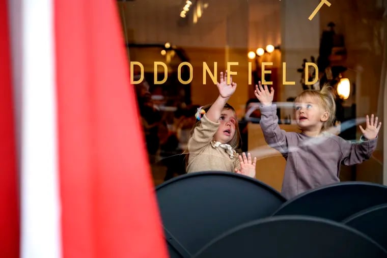 Three year-old friends Lola Browne and Madelyn Turner (right) examine the letters in the storefront window of Cafe Lift as they wait inside for brunch with their mothers in Haddonfield, N.J. Owners Michael and Jeniphur Pasquarello opened the original Cafe Lift in Philadelphia’s Callowhill neighborhood in 2003. Scene Through the Lens runs every Monday on page B-2. There is a template in Roxen. This sentence runs at the top of the photo: More of photographer Tom Gralish’s visual exploration of our region can be seen in his blog at Inquirer.com/sceneontheroad.