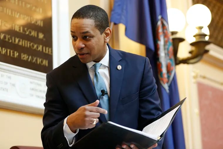 Virginia Lt. Gov Justin Fairfax looks over a briefing book prior to the start of the senate session at the Capitol in Richmond, Va., Thursday, Feb. 7, 2019. A California woman has accused Fairfax of sexually assaulting her 15 years ago.