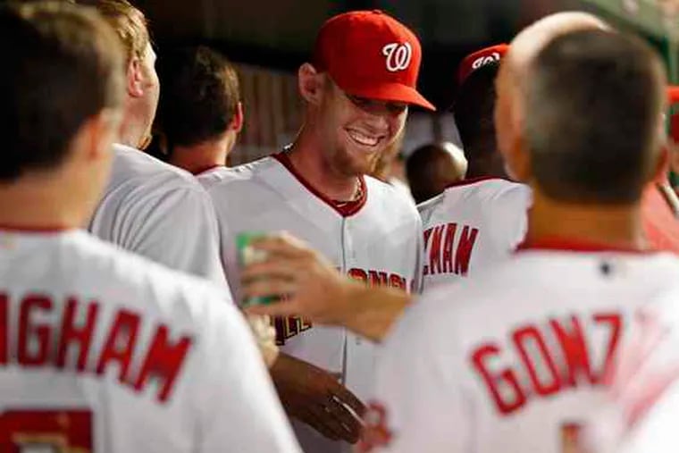 Stephen Strasburg is congratulated after striking out 14 in debut.