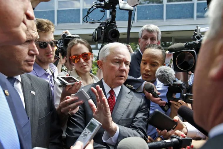 In this July 7, 2016, photo, Sen. Jeff Sessions, R-Ala., center, talks with reporters after a meeting with Republican presidential candidate Donald Trump and the Senate Republican Conference at the National Republican Senatorial Committee headquarters in Washington.