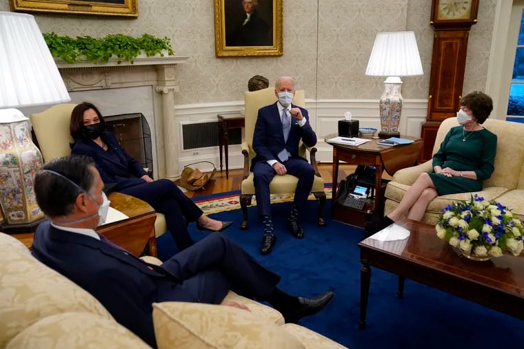 This Feb. 1 photo shows President Joe Biden (center) and Vice President Kamala Harris (second from left) meeting with Sen. Mitt Romney, R-Utah (left), Sen. Susan Collins, R-Maine, and others to discuss a coronavirus relief package.