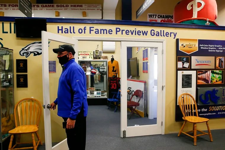 Spike's Trophies CEO Keith Baldwin stands at the front entrance to the Philadelphia Sports Hall Fame preview gallery in Northeast Philadelphia. About to lay off all his employees, Baldwin transformed Spike's into a call center for COVID-19 patients.