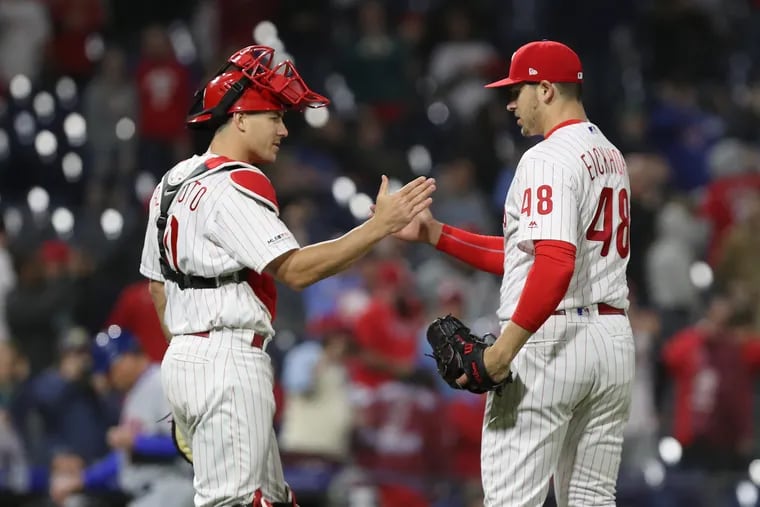 J.T. Realmuto (left), here congratulating Jerad Eickhoff after the pitcher's stellar relief appearance Tuesday, has started all but two games behind the plate for the Phillies this season.