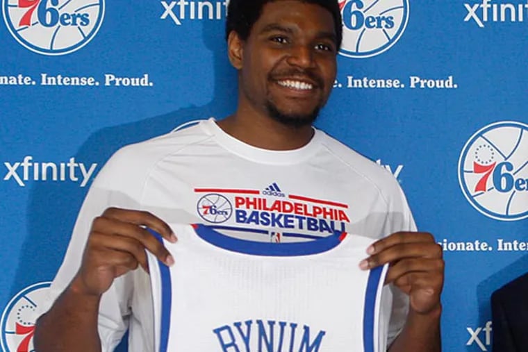 Philadelphia 76ers players, Andrew Bynum, left, and Jason Richardson, pose with their new jerseys after being introduced at a news conference in Philadelphia, Wednesday, Aug. 15, 2012. Bynum was traded to the 76ers from the Los Angeles Lakers and Richardson from the Orlando Magic. (AP Photo/Brynn Anderson)