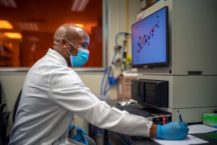 Sandile Cele, a researcher at the Africa Health Research Institute in Durban, South Africa, shown working on the omicron variant of the COVID-19 virus on Dec. 15.