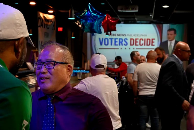 Republican candidate for mayor David Oh greets supporters arriving early at his election night party at Sweeney's Saloon in Northeast Philadelphia on Tuesday.