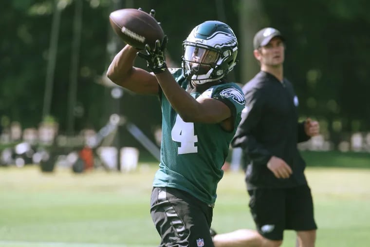 Eagles wide receiver Greg Ward Jr. makes a catch during minicamp at the Eagles NovaCare Complex last month. Ward played quarterback in college at Houston.