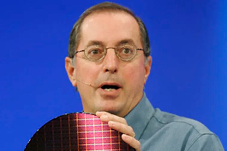 A replica of the first transistor (left), built 60 years ago. Paul Otellini, Intel Corp. CEO, holds a wafer of chips with billions of transistors.