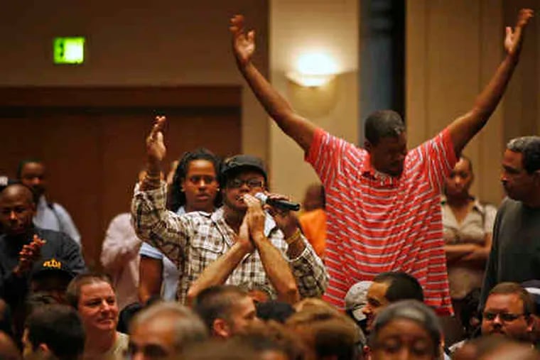 An employee gets a rise out of coworkers during a mandatory meeting with the Philadelphia Housing Authority board Thursday at the Convention Center.