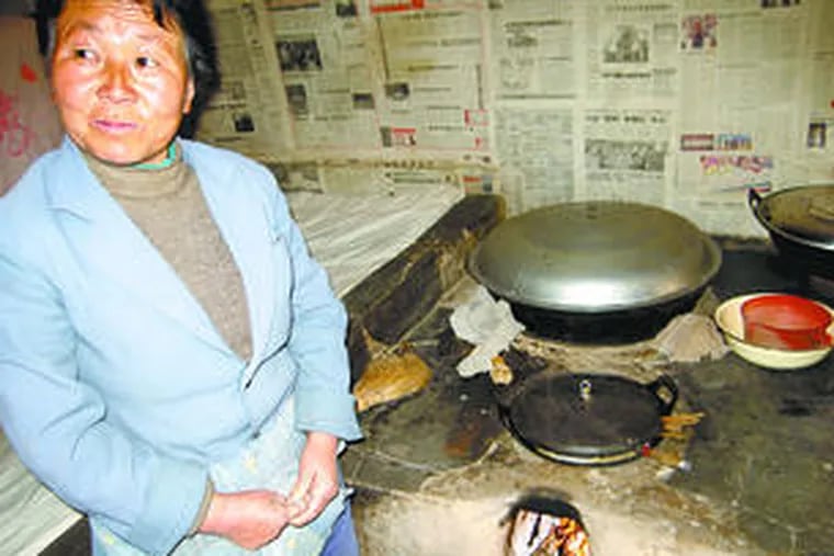 Wang Aifang says the cooking fire in her cave home in China&#0039;s Loess Plateau region warm her dwelling even in winter. &quot;The houses in the city have to use heat,&quot; she says. &quot;We don&#0039;t.&quot;