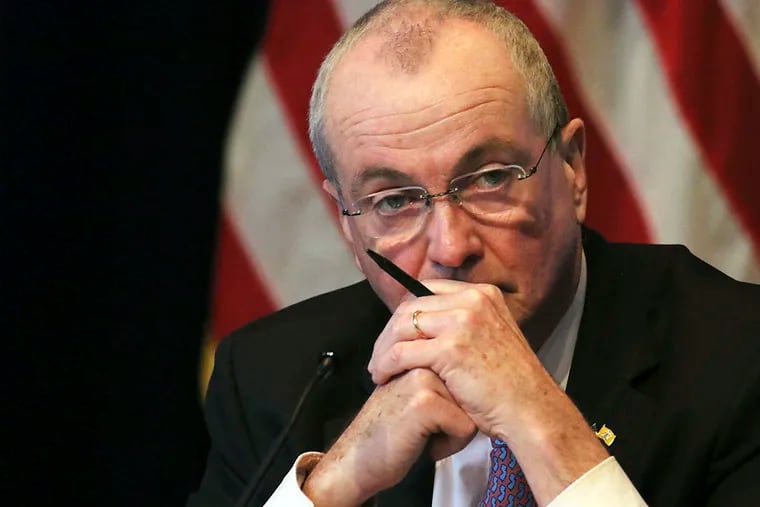 In this May 19, 2020 file photo New Jersey Gov. Phil Murphy listens during his daily coronavirus news conference at the War Memorial in Trenton, N.J.