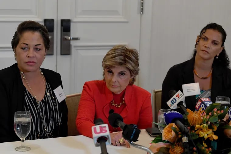 Attorney, Gloria Allred, center, along with her clients, Chelan Lasha, left and Lise-Lotte Lublin, right, Bill Cosby accusers, takes questions from reporters during a press conference at the Le Meridien Hotel in Philadelphia Pa. Sunday, September 23, 2018.