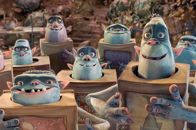 The Boxtrolls are a community of quirky creatures who have raised a human boy beneath the cobblestoned streets of Cheesebridge. (Focus Features)