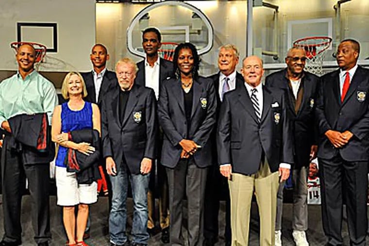 The 2012 class of inductees into the Basketball Hall of Fame poses for a photo at Friday's ceremony. (Jessica Hill/AP)