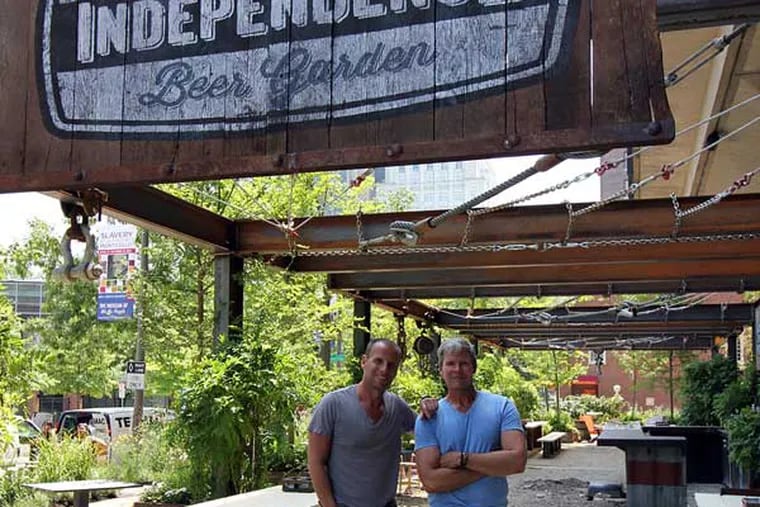 Michael Schulson (left) and landscape architect David Fierabend at Independence Beer Garden, July 8, 2014.