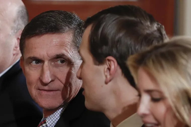 Former National Security Adviser Michael Flynn sits next to Jared Kushner during a news conference on February 10, 2017. Reports indicate it was Kushner who directed Flynn to contact the Russians.