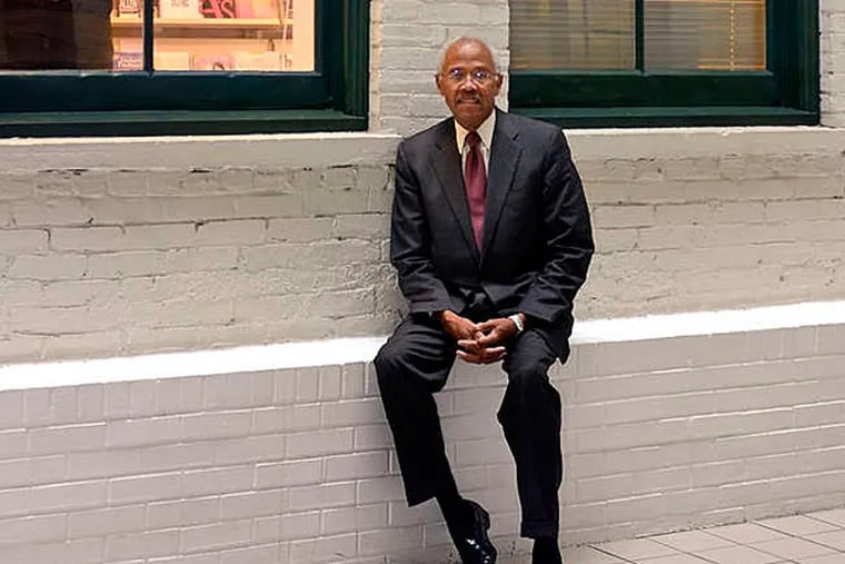 At PCA headquarters, retiring president Rodney D. Williams sits in the atrium. (Tom Gralish/Staff)