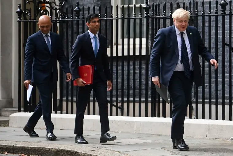From left, British Health Secretary Sajid Javid, Chancellor of the Exchequer Rishi Sunak and Prime Minister Boris Johnson arriving at No 9 Downing Street for a media briefing on May 7, 2021.