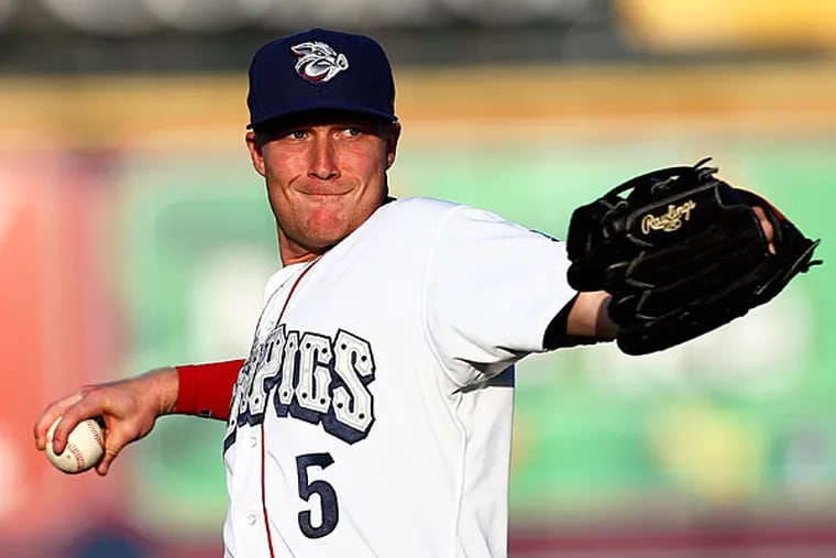 Cody Asche warms up prior to a game for the Lehigh Valley Iron Pigs. (Photo by Rich Schultz)