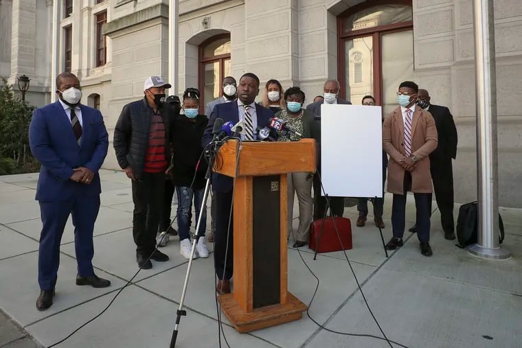 Attorney Shaka Johnson, who is representing the Wallace family, speaks during a press conference in front of City Hall on Nov. 6.