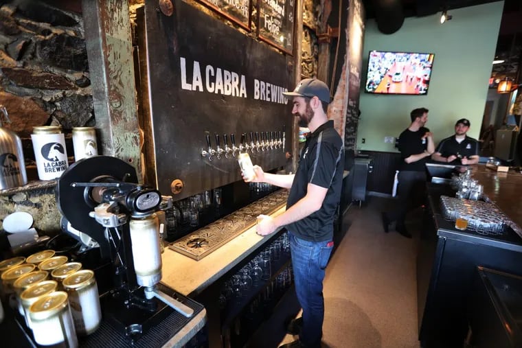 Chuck Golder, 32, fills a crowler at at La Cabra Brewing in Berwyn. La Cabra will host a “Suburban Love Pop-up Beer Garden” on June 10.