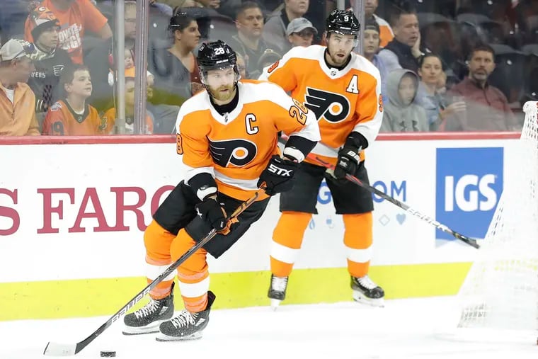 Flyers left winger Claude Giroux skates with the puck in a preseason game against Boston. The Flyers play their home opener Wednesday against the Devils.