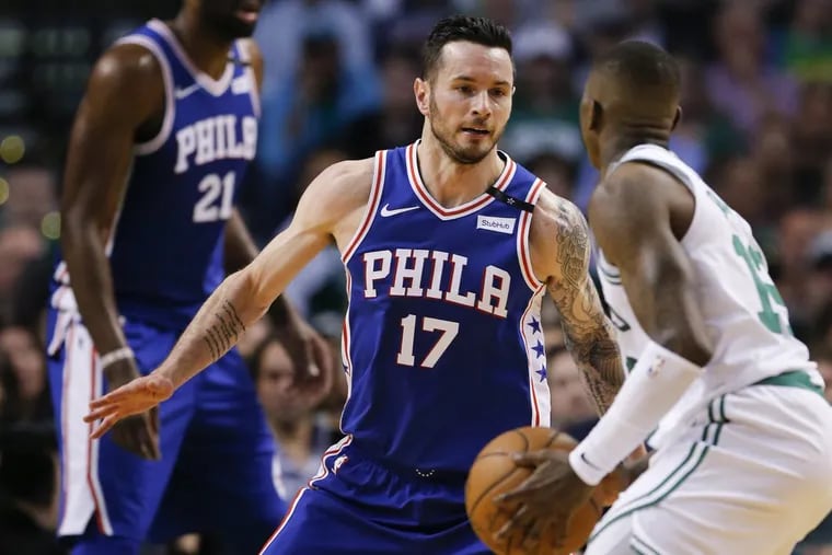 Sixers guard JJ Redick defending Celtics guard Terry Rozier during the second quarter.
