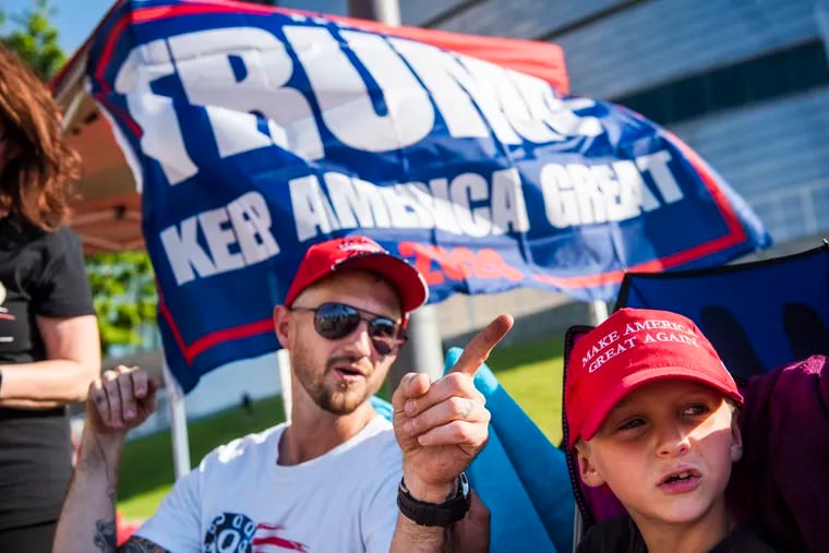 Zach Moushon and his son, Holden Moushon, 8, camp with fellow Donald Trump supporters outside the BOK Center in Tulsa, Oklahoma, on June 17, 2020, days before the start of the official rally.