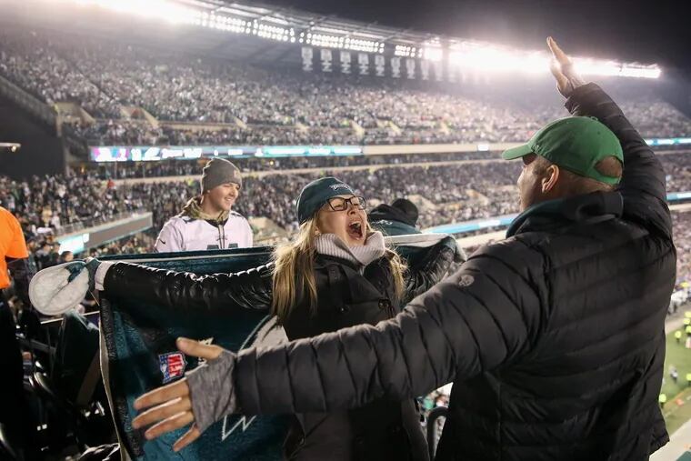 Eagles fans celebrate a touchdown during the second quarter of the NFC Championship game at Lincoln Financial Field on Sunday, Jan. 21, 2017. TIM TAI / Staff Photographer