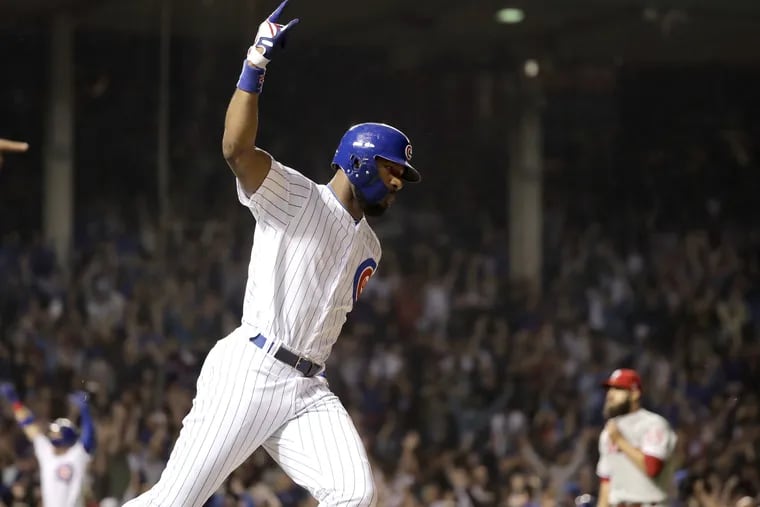Cubs outfielder Jason Heyward celebrates his walk-off grand slam off Phillies reliever Adam Morgan (right) on Wednesday. 