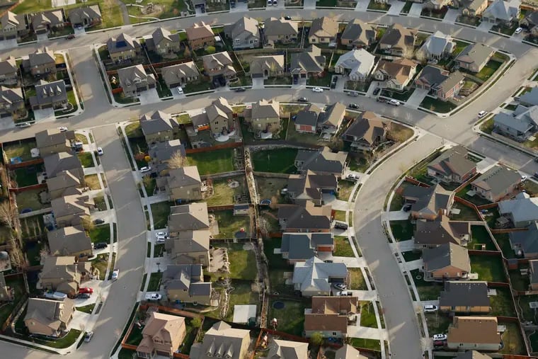 This April 2019 photo shows homes in suburban Salt Lake City.