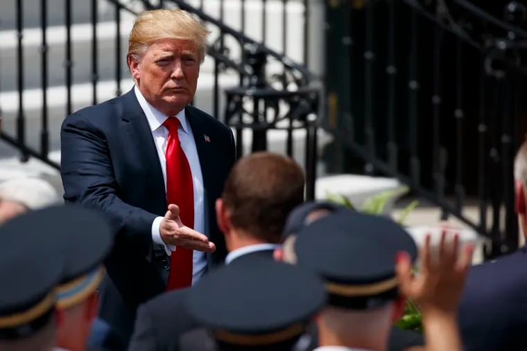 President Donald Trump shakes hands during a "Celebration of America" event at the White House, Tuesday, June 5, 2018, in Washington, in lieu of a Super Bowl celebration for the NFL's Philadelphia Eagles that he canceled. 