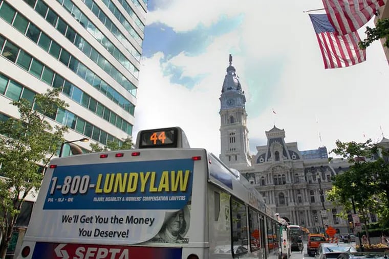 Picture of a SEPTA bus with the Lundy Law advertisement on the rear. Photograph taken along Market St. west of city hall near 15th St. in Philadelphia on Tuesday, August 27, 2013. ( ALEJANDRO A. ALVAREZ / STAFF PHOTOGRAPHER )